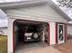 Garage with open door, one car parked inside at 8171 Pickwick Rd, North Port, FL 34287