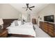 Main bedroom with king-size bed and ensuite bathroom at 9075 Misty Creek Dr, Sarasota, FL 34241