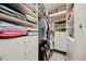 Spacious walk-in closet with ample shelving and drawers at 9075 Misty Creek Dr, Sarasota, FL 34241