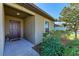 Inviting front door entrance with landscaping, showing the home's curb appeal at 925 Wynnmere Walk Ave, Ruskin, FL 33570