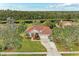 Single-story house with tile roof, two-car garage, and large backyard at 10037 Cherry Hills Avenue Cir, Bradenton, FL 34202