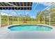 Inviting screened pool with tiled deck and a beautiful view at 10037 Cherry Hills Avenue Cir, Bradenton, FL 34202