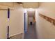 A look down the basement stairs featuring a trash can, hooks, and limited lighting at 109 Tortuga Dr, Nokomis, FL 34275
