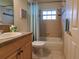 Bathroom featuring tiled shower and a wooden vanity at 109 Tortuga Dr, Nokomis, FL 34275