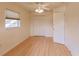 Bedroom featuring laminate floors, a ceiling fan, and a double door closet at 109 Tortuga Dr, Nokomis, FL 34275