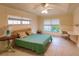 Bedroom featuring a ceiling fan, tiled floor, natural light, and built-in desk at 109 Tortuga Dr, Nokomis, FL 34275