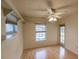 Bright bedroom with a ceiling fan and a large window overlooking the front yard at 109 Tortuga Dr, Nokomis, FL 34275