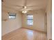 Bedroom featuring laminate floors, ceiling fan, and natural light at 109 Tortuga Dr, Nokomis, FL 34275