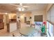 Open concept dining area features tile floors, a ceiling fan, and access to the kitchen at 109 Tortuga Dr, Nokomis, FL 34275