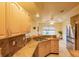 Kitchen featuring stainless steel appliances, stone countertops, and light wood cabinetry at 109 Tortuga Dr, Nokomis, FL 34275