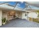 Screened-in patio area with lounge chair overlooking the yard and a glimpse of the home's interior at 109 Tortuga Dr, Nokomis, FL 34275