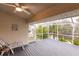 Cozy screened porch with views of the water and tropical plants at 109 Tortuga Dr, Nokomis, FL 34275