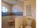 Walk-in shower featuring tiled walls, octagon window, and corner seat at 109 Tortuga Dr, Nokomis, FL 34275