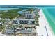 Aerial view of beachfront property, showing building, pool, and beach at 1102 Benjamin Franklin Dr # 407, Sarasota, FL 34236