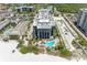 Aerial view of building and pool, with beach access at 1102 Benjamin Franklin Dr # 407, Sarasota, FL 34236