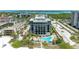 Aerial view of a condo building with pool, offering beach and water views at 1102 Benjamin Franklin Dr # 407, Sarasota, FL 34236