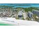 Breathtaking aerial view of beachfront condos overlooking the ocean and white sand beach at 1102 Benjamin Franklin Dr # 407, Sarasota, FL 34236