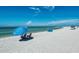 Relaxing beach scene with people enjoying the sun and sand at 1102 Benjamin Franklin Dr # 407, Sarasota, FL 34236