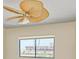 Bedroom window view overlooking nearby construction and featuring a decorative ceiling fan at 1102 Benjamin Franklin Dr # 407, Sarasota, FL 34236
