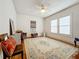 Charming bedroom with hardwood floors, large windows, and ceiling fan at 1420 22Nd W St, Bradenton, FL 34205