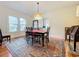 Bright dining room with hardwood floors, a chandelier, and large windows at 1420 22Nd W St, Bradenton, FL 34205