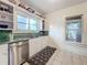 Updated kitchen with stainless steel appliances and green countertops at 1420 22Nd W St, Bradenton, FL 34205