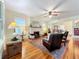 Spacious living room with hardwood floors, fireplace, and comfortable seating at 1420 22Nd W St, Bradenton, FL 34205