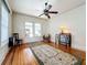Spacious living room with hardwood floors, large windows, and ceiling fan at 1420 22Nd W St, Bradenton, FL 34205
