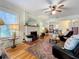 Spacious living room with hardwood floors, fireplace, and comfortable seating at 1420 22Nd W St, Bradenton, FL 34205