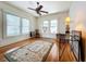 Spacious living room with hardwood floors, large windows, and ceiling fan at 1420 22Nd W St, Bradenton, FL 34205