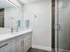 Modern bathroom with a glass shower and wood vanity at 1621 Pine Bay Dr, Sarasota, FL 34231