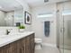 Modern bathroom with glass shower, updated vanity, and sleek fixtures at 1621 Pine Bay Dr, Sarasota, FL 34231