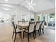 Bright dining room with a large table and access to the backyard at 1621 Pine Bay Dr, Sarasota, FL 34231