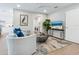 Living room with modern furniture, laundry access, and a TV at 1621 Pine Bay Dr, Sarasota, FL 34231