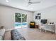Home office with sliding glass doors opening to a view of the pool at 1621 Pine Bay Dr, Sarasota, FL 34231