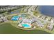 Aerial view of community pool, tennis and pickleball courts, and clubhouse at 17923 Polo Trl, Bradenton, FL 34211
