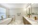 Bathroom boasts double sinks, quartz countertops and modern fixtures at 17923 Polo Trl, Bradenton, FL 34211