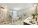 Elegant bathroom with double vanity, soaking tub, and walk-in shower at 17923 Polo Trl, Bradenton, FL 34211