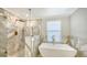 Spa-like bathroom with a soaking tub and walk-in shower at 17923 Polo Trl, Bradenton, FL 34211