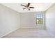 Well-lit bedroom with neutral walls and carpeted floor at 17923 Polo Trl, Bradenton, FL 34211