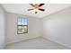 Bright bedroom with neutral walls and carpet at 17923 Polo Trl, Bradenton, FL 34211