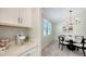 Cozy breakfast nook with round table and cane chairs at 17923 Polo Trl, Bradenton, FL 34211