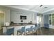 Modern community bar with blue stools and a large countertop at 17923 Polo Trl, Bradenton, FL 34211