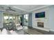 Relaxing community room with fireplace, comfortable seating, and pool view at 17923 Polo Trl, Bradenton, FL 34211
