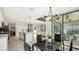 Open dining area with a view of the kitchen and backyard at 17923 Polo Trl, Bradenton, FL 34211