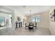 Bright dining area with a round table and four chairs, near the kitchen at 17923 Polo Trl, Bradenton, FL 34211