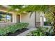 Front entrance with stone accents and lush landscaping at 17923 Polo Trl, Bradenton, FL 34211