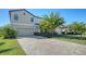 Two-story house with a paver driveway and lush landscaping at 17923 Polo Trl, Bradenton, FL 34211