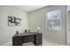 Bright home office features a desk, window, and artwork at 17923 Polo Trl, Bradenton, FL 34211