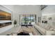 Open living room showcasing a cozy seating area and pool access at 17923 Polo Trl, Bradenton, FL 34211